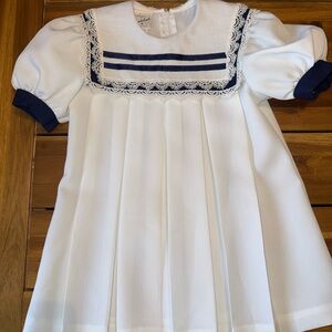 Girl’s size 5 vintage sailor dress. White with blue trim.
